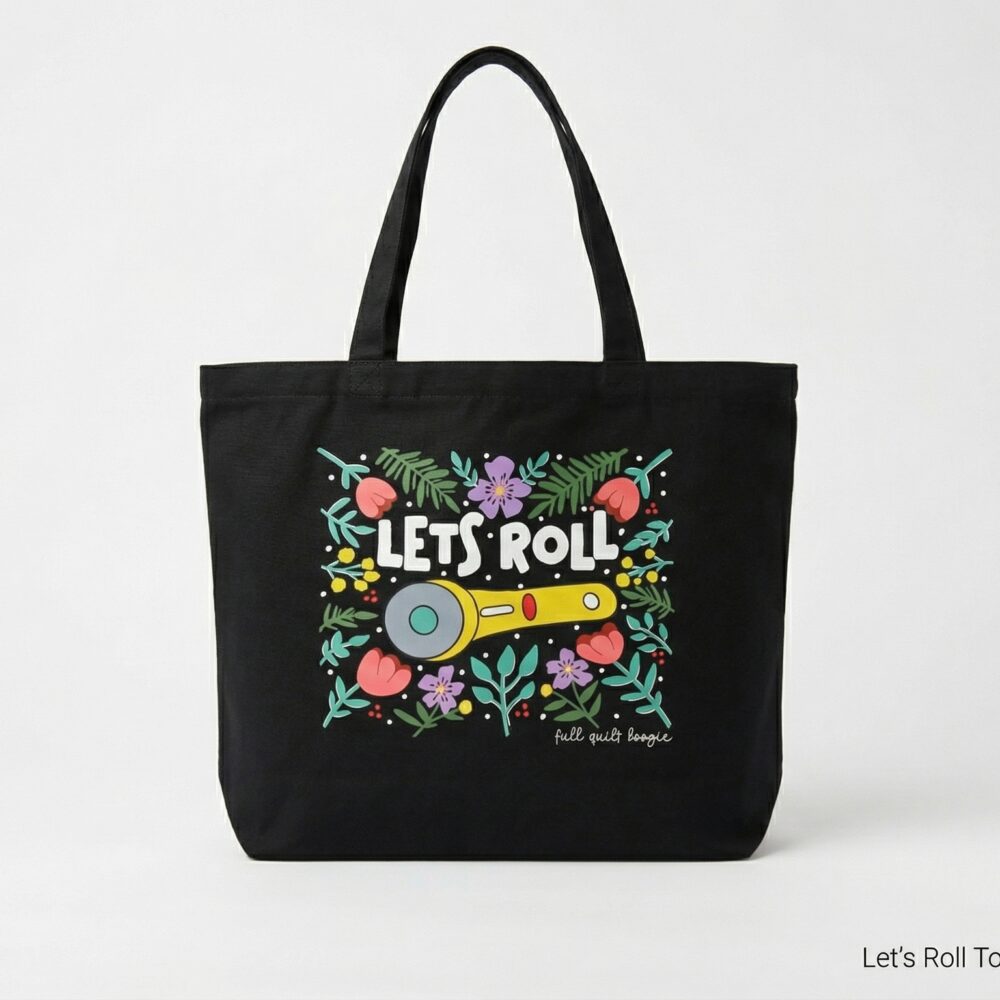 Black tote bag with a colorful floral print and the слова 'LET'S ROLL' graphic on the front.